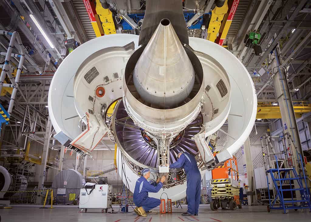 Mechanics working on the inner workings of a plane